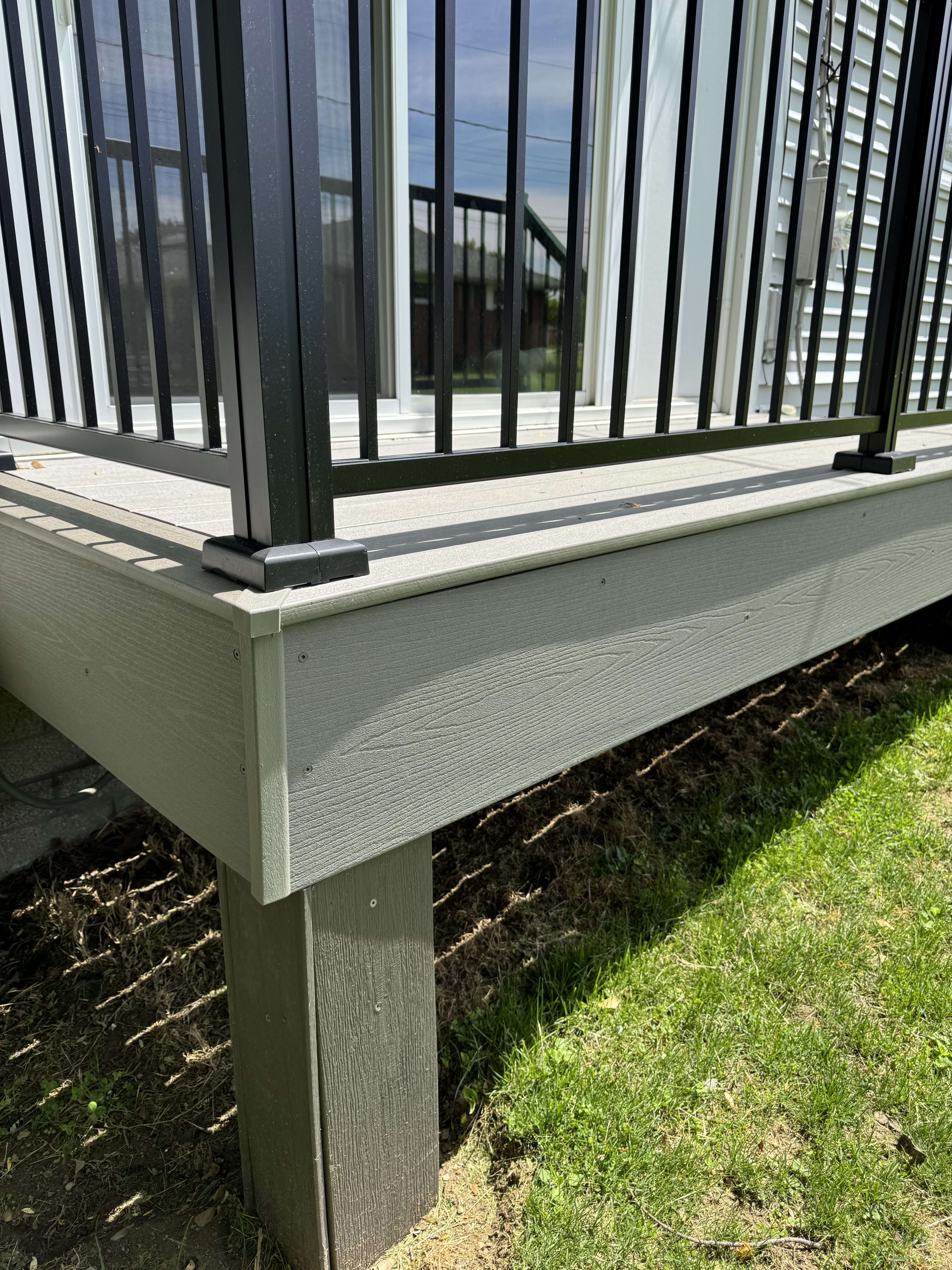 GAPCAP corner caps installed on a real backyard deck