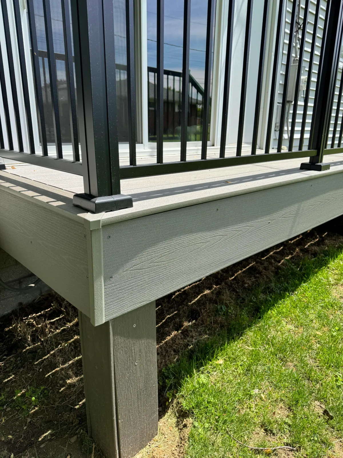 GAPCAP corner caps installed on a real backyard deck